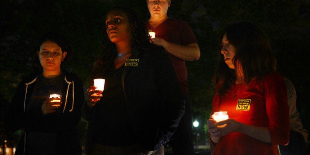 WASHINGTON, D.C., SEPTEMBER 16, 2013: A candlelight vigil is held at Freedom Plaza for the victims of the Navy Yard attack than killed 13 people including the gunman. (Photo by Astrid Riecken for The Washington Post via Getty Images)