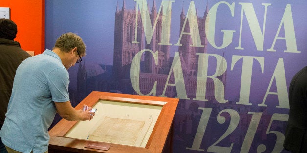 Visitors tour the Library of Congress new exhibit, Magna Carta: Muse and Mentor, Thursday, Nov. 6, 2014, in Washington. Britain's Princess Anne, the daughter of Queen Elizabeth II presided over the ceremony Thursday that celebrated the historic document's influence that eventually led to the constitutional rights written by the Founding Fathers of the United States. Â (AP Photo/Evan Vucci)