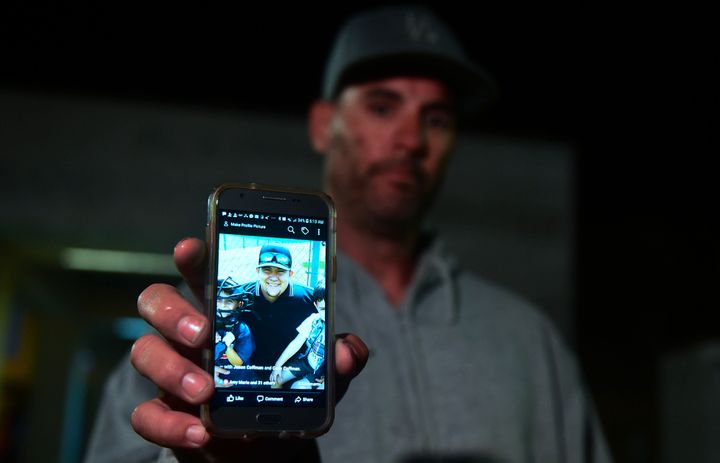 Jason Coffman displays a photo of his son Cody, who was shot and killed at the Borderline Bar & Grill on Nov. 7, 2018.