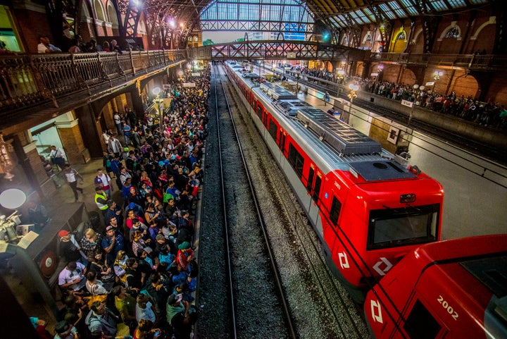 Passengers at a train station in Brazil. 