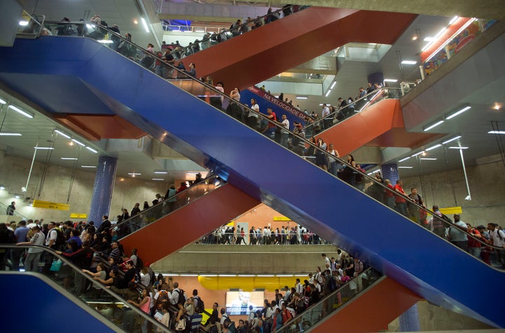 This file photo from 2013 shows passengers riding escalators to access subway platforms in Sao Paulo.