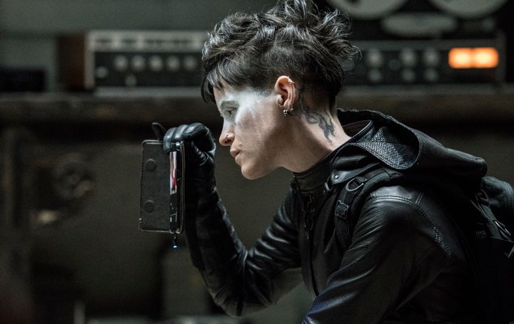 In "The Girl In The Spider's Web," Lisbeth is a club kid Batman, a stylish angel of death, complete with getaway cars and impenetrable stares.