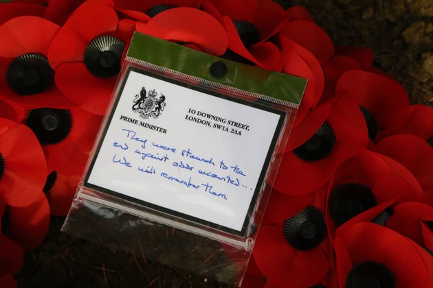 Prime Minister Theresa May left tributes at the graves of the fallen