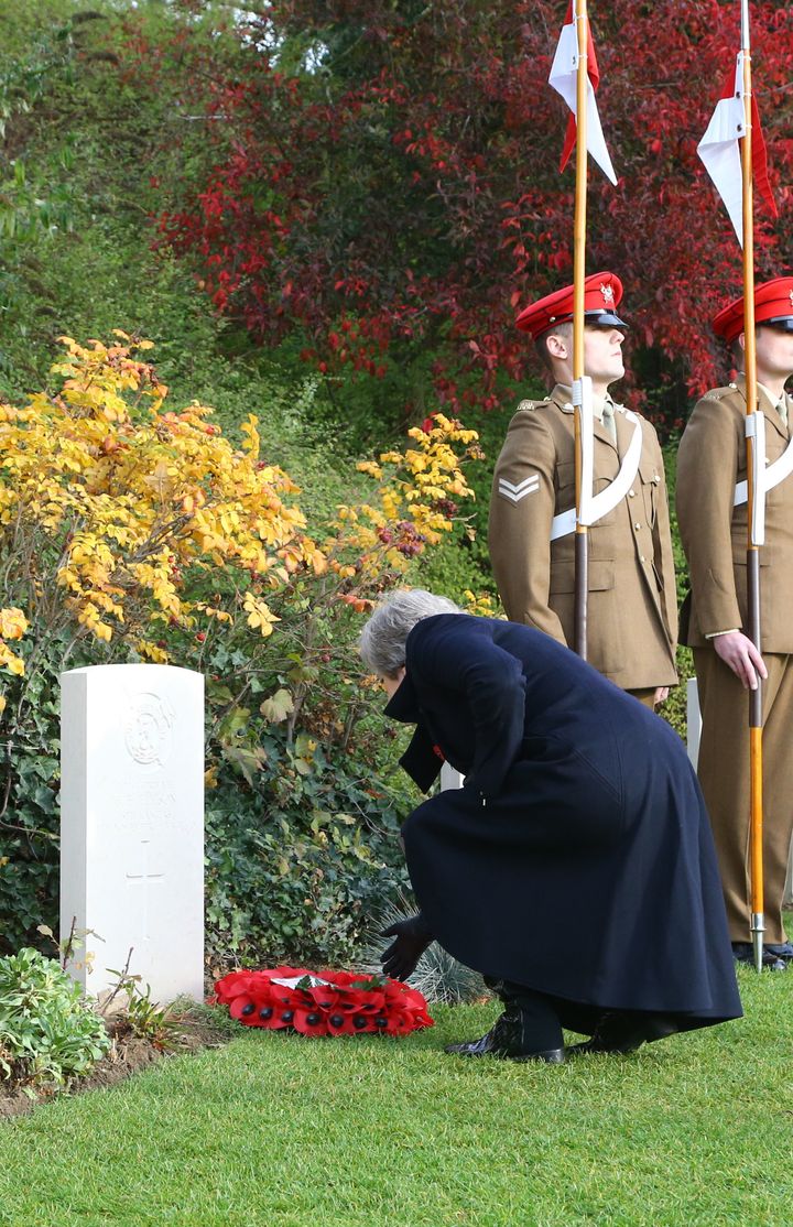 May is visiting war cemeteries in Belgium and France alongside French President Emmanuel Macron and Belgian Prime Minister Charles Michel