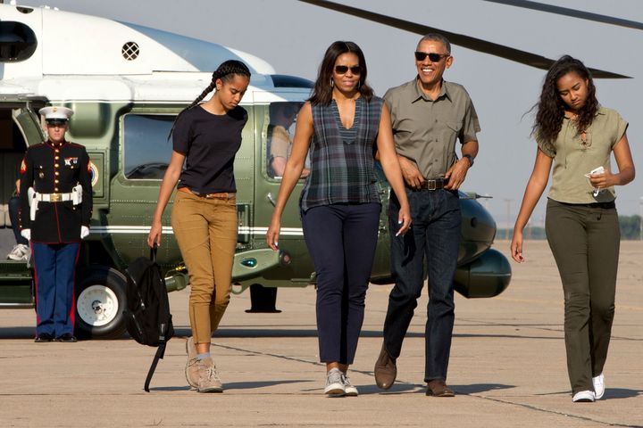 The Obamas, pictured with their daughters Sasha and Malia two years ago 