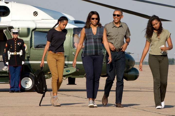 The Obamas, pictured with their daughters Sasha and Malia two years ago 