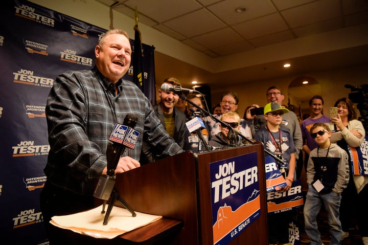 Sen. Jon Tester, surrounded by family and supporters, announces his victory Wednesday in Great Falls, Montana.