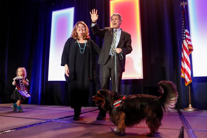 Sen. Sherrod Brown, D-Ohio, takes the stage alongside his wife, Connie Schultz, during an election-night watch party on Nov. 6, 2018, in Columbus.