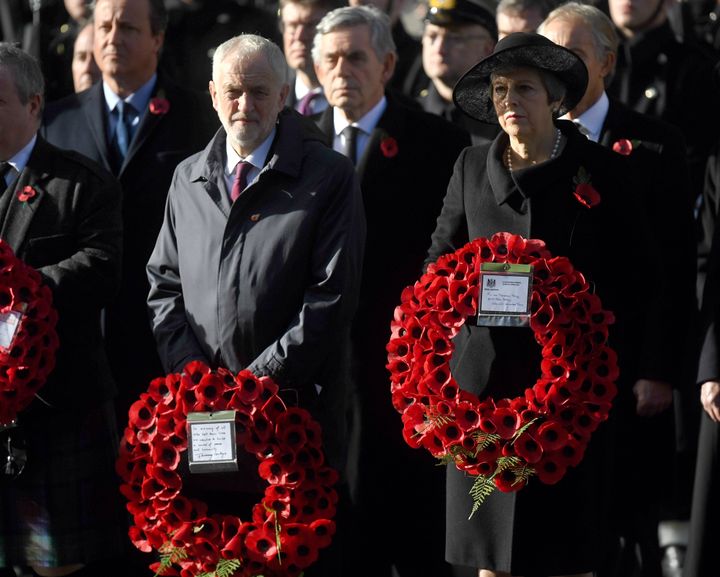 Labour leader Jeremy Corbyn and Prime Minister Theresa May lay wreaths during the remembrance service at the Cenotaph memorial in Whitehall.