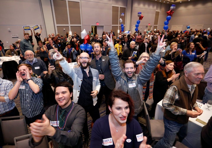 Supporters of Sharice Davids celebrate her victory over the Republican incumbent, Kevin Yoder, in their Kansas House race.