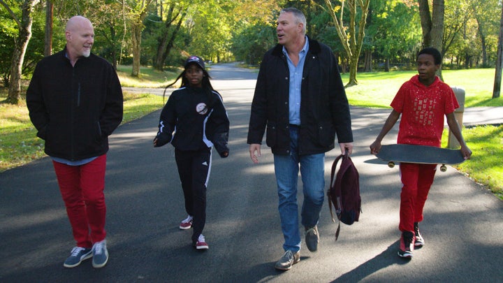 Rob Scheer and his husband, Reece, left, fostered two sets of siblings and later adopted all four children.