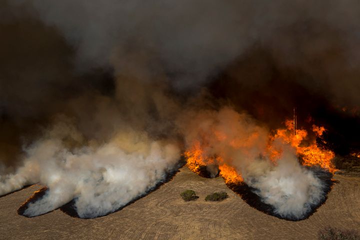 Flames from the Woolsey Fire overtake the Reagan Ranch, once owned by President Ronald Reagan, at Malibu Creek State Park on Nov. 9, 2018, near Malibu, California. After experiencing a mass shooting, residents of Thousand Oaks are threatened by two nearby dangerous wildfires, including the Woolsey Fire, which has reached the Pacific coast.