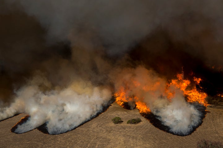 Flames from the Woolsey Fire overtake the Reagan Ranch, once owned by President Ronald Reagan, at Malibu Creek State Park on Nov. 9, 2018, near Malibu, California. After experiencing a mass shooting, residents of Thousand Oaks are threatened by two nearby dangerous wildfires, including the Woolsey Fire, which has reached the Pacific coast.