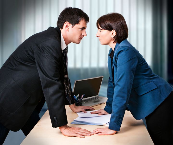 businesswoman and businessman are fighting