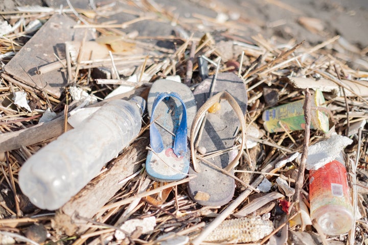 Flip-flops, water bottles and other rubbish litter a beach in Sanur on the island of Bali in Indonesia.