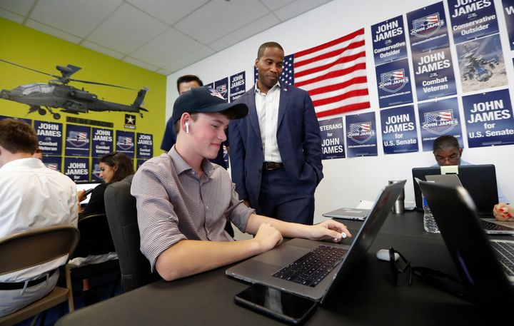 Republican U.S. Senate candidate John James talks with campaign workers at his headquarters in Livonia, Mich. James lost last week to incumbent Debbie Stabenow.