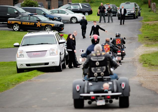 Mourners arriving at a funeral for members of the Rhoden family in 2016 