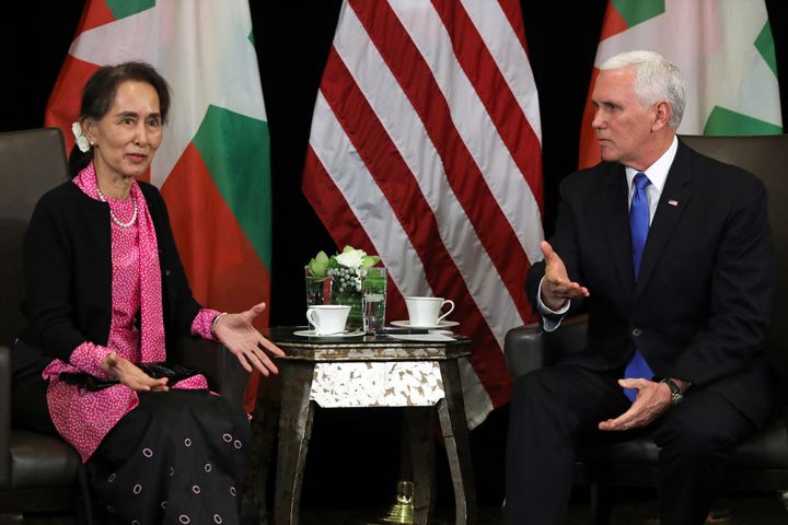 Myanmar leader Aung San Suu Kyi, left, discussed the case of two imprisoned Reuters reporters with Vice President Mike Pence, right, in Singapore on Wednesday.