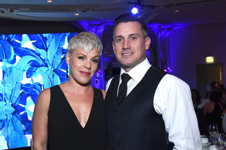 Singing star Pink with husband Carey Hart, who appeared to threaten looters with gunfire in a controversial Instagram post.&n