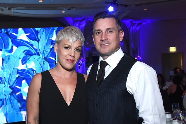 Singing star Pink with husband Carey Hart, who appeared to threaten looters with gunfire in a controversial Instagram post. 