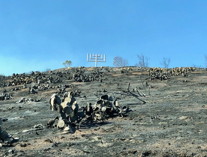 The giant metal and concrete menorah at Rabbi Alfred Wolf Inspiration Point in Southern California still stands after the Woolsey fire.