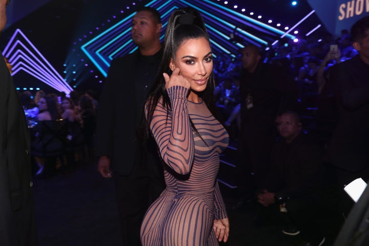Kim Kardashian poses for photos at the People's Choice Awards in November. Her interaction with Tristan Thompson as Khloe Kar