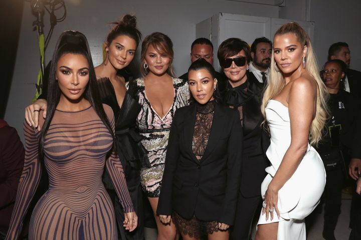 The KarJenner family poses with Chrissy Teigen behind the scenes of the People's Choice Awards.