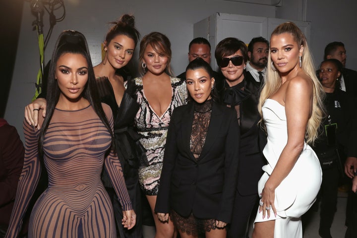 The KarJenner family poses with Chrissy Teigen backstage at the People's Choice Awards.