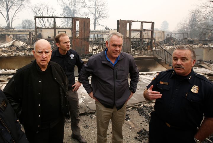 (From left) California Gov. Jerry Brown, Federal Emergency Management Agency Director Brock Long, Interior Secretary Ryan Zinke and Cal Fire's Scott Upton at the fire-ravaged Paradise Elementary School, Nov. 14, in Paradise, California.