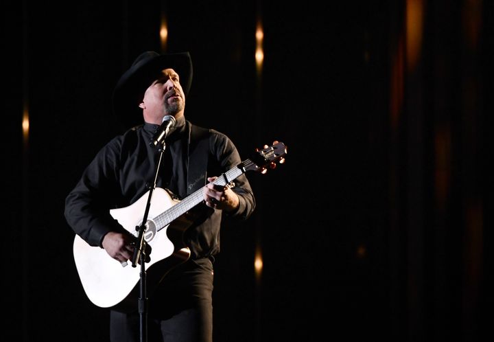 “Let the music unite us with love in their enduring memory,” Garth Brooks said as a moment of silence honored the 12 killed at Borderline Bar & Grill.