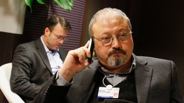 FILE - In this Jan. 29, 2011 file photo, Saudi journalist Jamal Khashoggi speaks on his cellphone at the World Economic Forum in Davos, Switzerland. Saud Al-Mojeb, Saudi Arabiaâs top prosecutor, is recommending the death penalty for five suspects charged with ordering and carrying out the killing of Saudi writer Jamal Khashoggi. Al-Mojeb told a press conference in Riyadh Thursday, Nov. 15, 2018, that Khashoggiâs killers had been planning the operation since September 29, three days before he was killed inside the kingdomâs consulate in Istanbul. (AP Photo/Virginia Mayo, File)