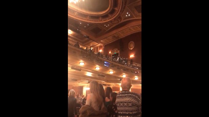Video taken inside of the Hippodrome theater shows stunned guests staring up into the balcony as others scream, “Get out" at the disrupter.