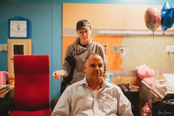 Madi's grandfather sits down to cut his hair to show support for his granddaughter.