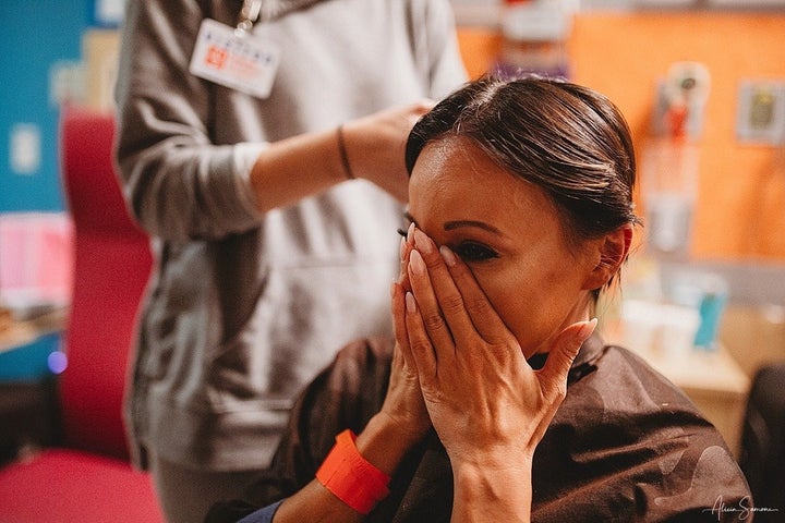 Ashley Jewett sits down for a haircut to show support for her daughter, 5-year-old Madi, who is undergoing aggressive leukemia treatment.