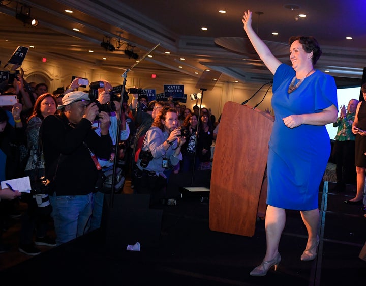 Katie Porter, the Democratic candidate for the 45th Congressional District, waves to supporters after speaking on election ni