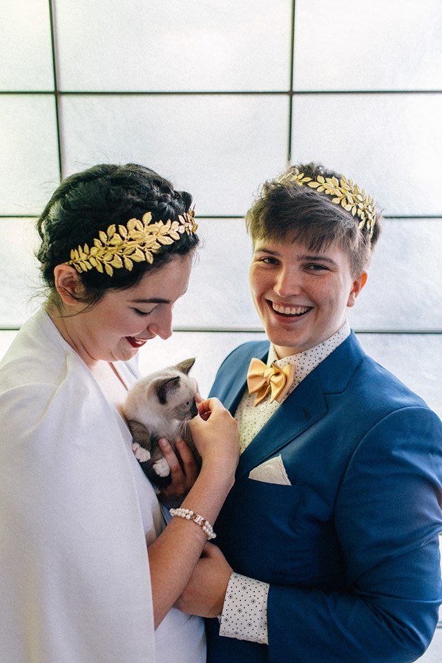 Colleen (left), a kitty and Iz on their wedding day.
