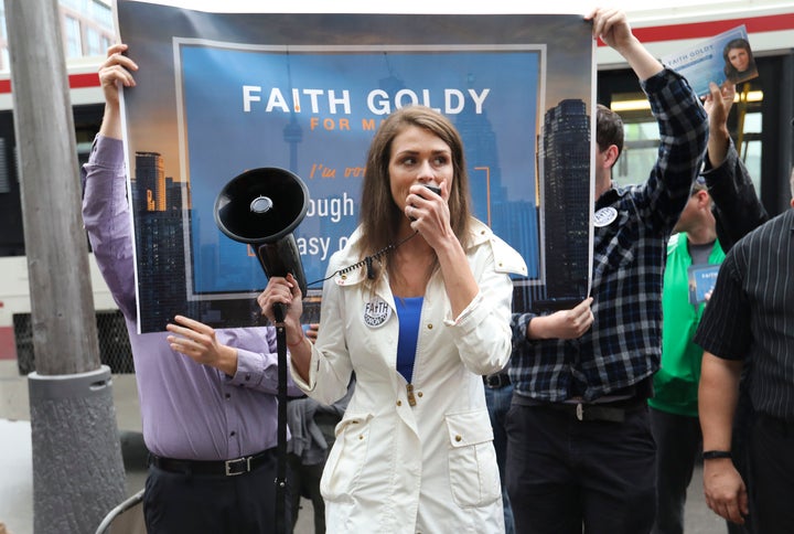 Toronto mayoral candidate Faith Goldy and some of her supporters protested outside a mayoral debate to which she was not invited. 