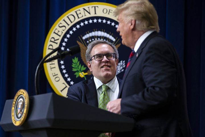 Acting EPA Administrator Andrew Wheeler greets President Donald Trump at a press conference. 