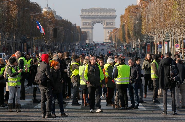 Protesters block the Champs Elysees avenue to protest fuel taxes in Paris, France, on Saturday.
