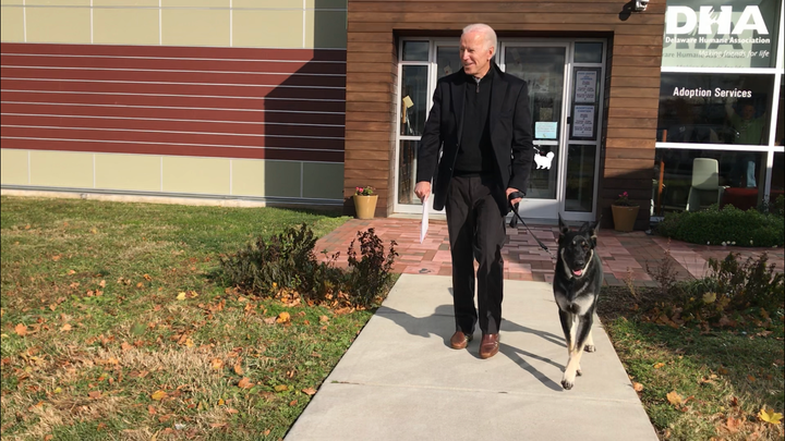 Joe Biden walks out of the Delaware Humane Association with his canine pal Major.