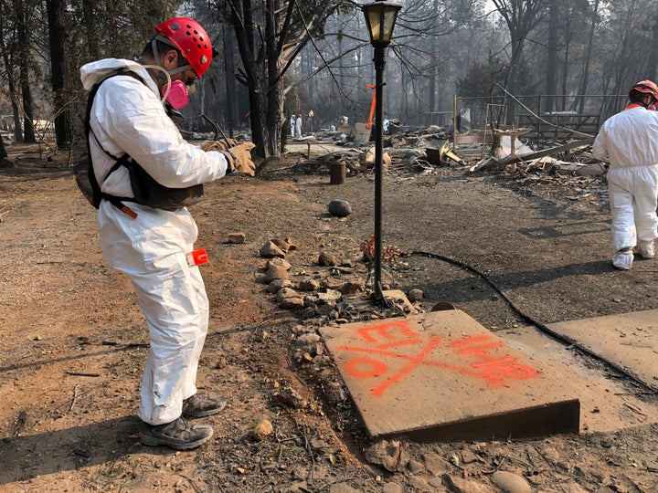 When no remains are found, volunteers spray-paint a large, orange "0'' near the house.