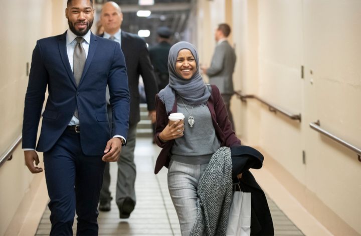 Rep.-elect Ilhan Omar, D-Minn., center, heads to a Democratic Caucus meeting in the basement of the Capitol as new members of the House and veteran representatives gathered behind closed doors to discuss their agenda when they become the majority in the 116th Congress, in Washington, on Nov. 15, 2018.
