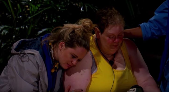 Anne is comforted by her campmates