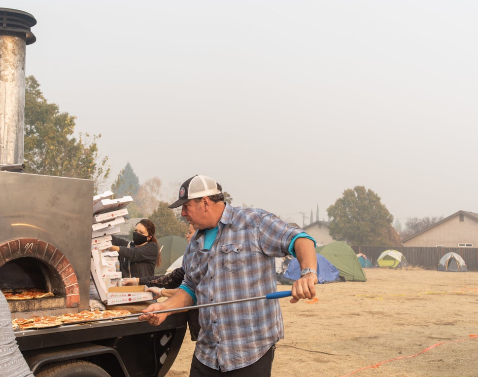 Jim King cooking pizzas for evacuees.