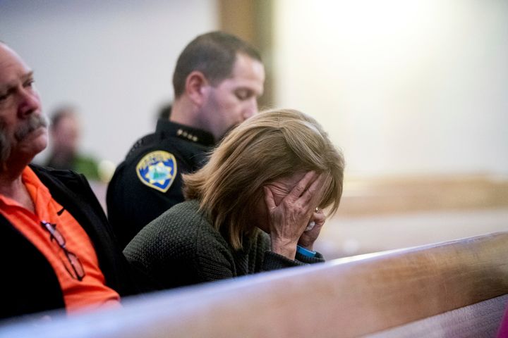 Lauren Gill, the town manager for Paradise, California, cries during a vigil for Camp Fire victims on Sunday at the First Christian Church of Chico.
