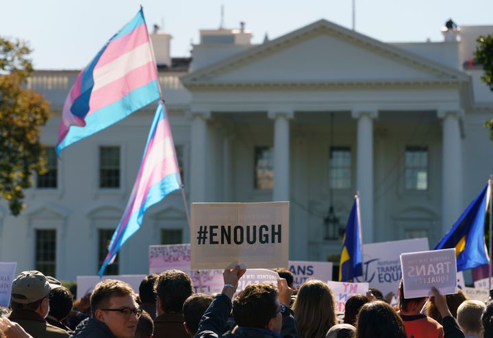 Protesters gather in front of the White House in October for a #WontBeErased rally after reports that the Trump administration plans to exclude transgender and nonbinary people from its legal definition of gender.