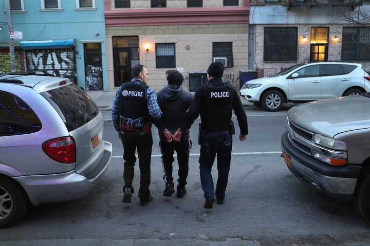 ICE officers arrest a man during a raid in Brooklyn, New York. 