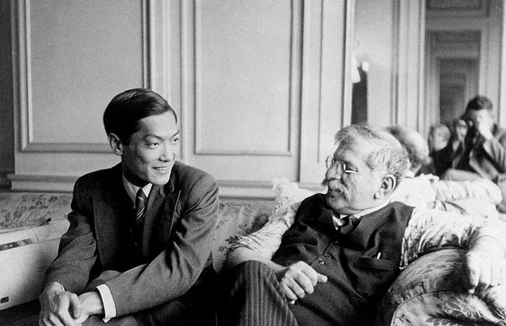 Magnus Hirschfeld, on the right, sits with his partner, Tao Li, at the fourth conference of the World League for Sexual Refor