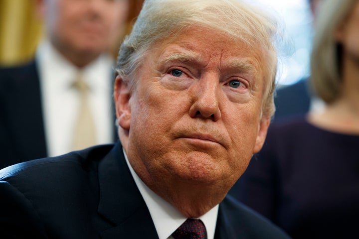 Donald Trump listens to a question during a signing ceremony in the Oval Office on Nov. 16, 2018.