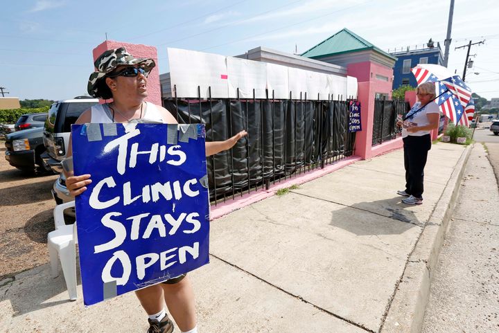 Abortion rights supporter and clinic escort Michelle Colon stands outside the Jackson Women's Health Organization, Mississippi's last abortion clinic.
